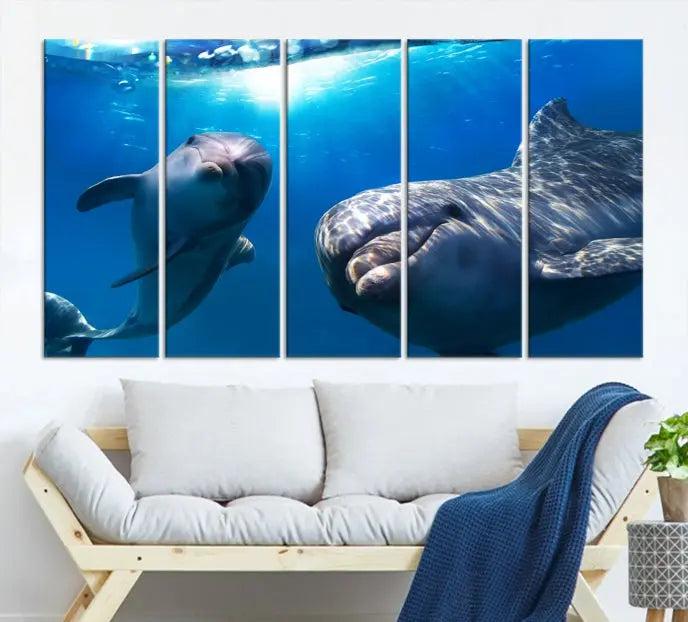 The Dolphin and Ocean Life Wall Art Canvas Print, a museum-quality piece depicting dolphins swimming, is a stunning artwork offered with free shipping.