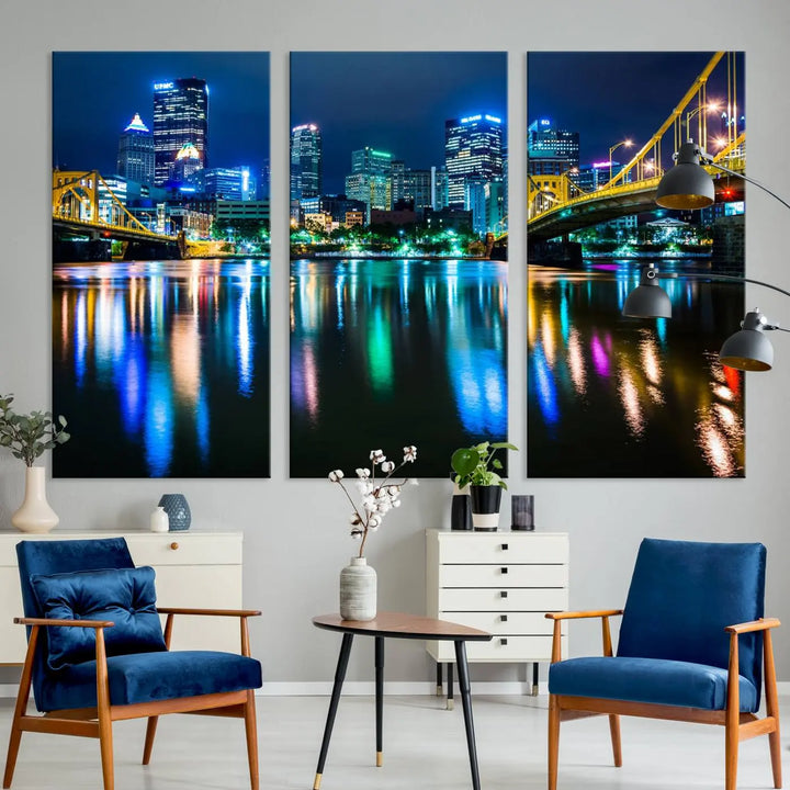 The "Downtown Pittsburgh at Night Canvas Wall Art" is a stunning museum-quality print that showcases the Pittsburgh skyline, reflecting over water and adorned with bright city lights.