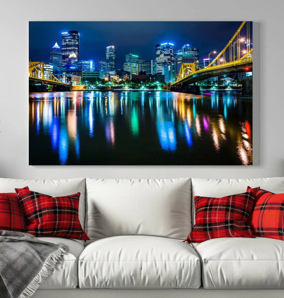 The "Downtown Pittsburgh at Night Canvas Wall Art" is a stunning museum-quality print that showcases the Pittsburgh skyline, reflecting over water and adorned with bright city lights.