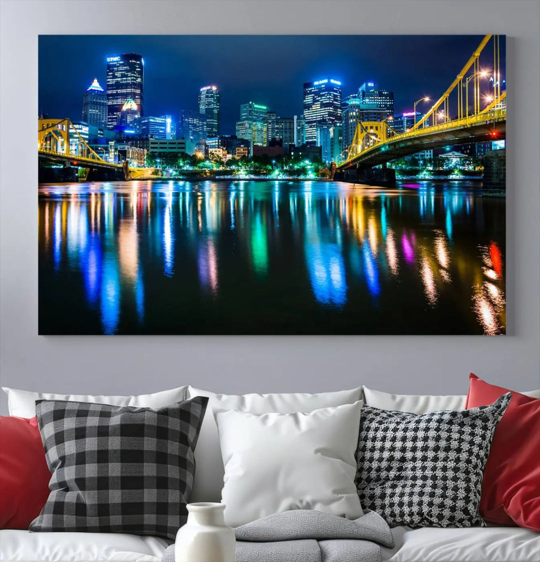 The "Downtown Pittsburgh at Night Canvas Wall Art" is a stunning museum-quality print that showcases the Pittsburgh skyline, reflecting over water and adorned with bright city lights.