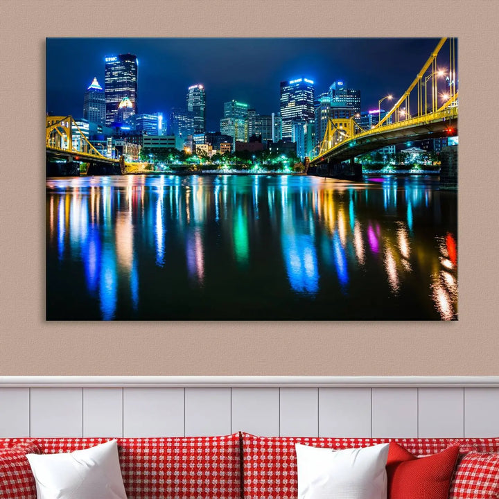 The "Downtown Pittsburgh at Night Canvas Wall Art" is a stunning museum-quality print that showcases the Pittsburgh skyline, reflecting over water and adorned with bright city lights.