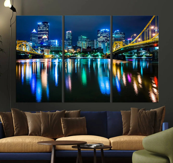 The "Downtown Pittsburgh at Night Canvas Wall Art" is a stunning museum-quality print that showcases the Pittsburgh skyline, reflecting over water and adorned with bright city lights.