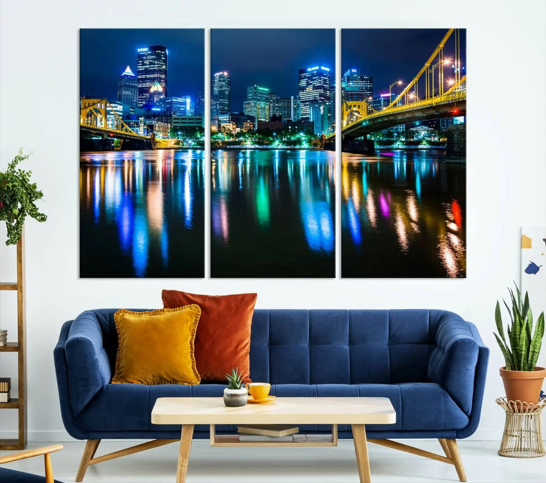 The "Downtown Pittsburgh at Night Canvas Wall Art" is a stunning museum-quality print that showcases the Pittsburgh skyline, reflecting over water and adorned with bright city lights.