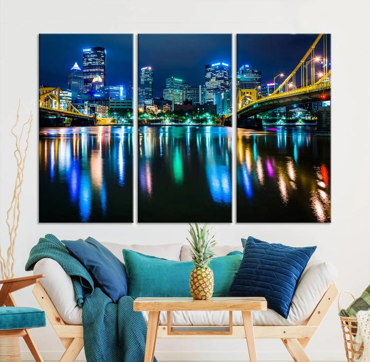 The "Downtown Pittsburgh at Night Canvas Wall Art" is a stunning museum-quality print that showcases the Pittsburgh skyline, reflecting over water and adorned with bright city lights.