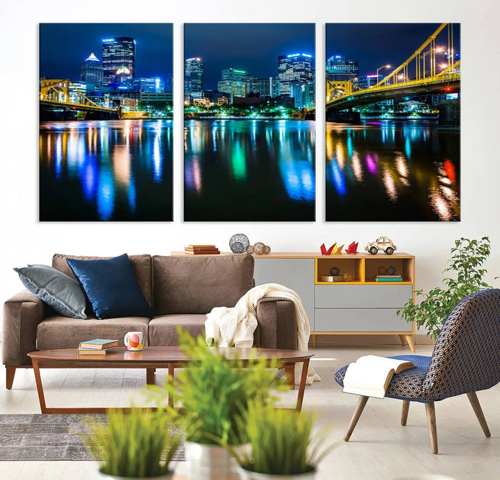 The "Downtown Pittsburgh at Night Canvas Wall Art" is a stunning museum-quality print that showcases the Pittsburgh skyline, reflecting over water and adorned with bright city lights.