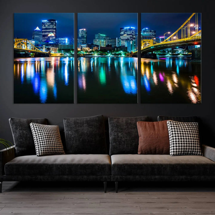 The "Downtown Pittsburgh at Night Canvas Wall Art" is a stunning museum-quality print that showcases the Pittsburgh skyline, reflecting over water and adorned with bright city lights.