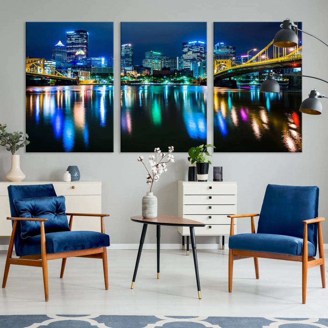 The "Downtown Pittsburgh at Night Canvas Wall Art" is a stunning museum-quality print that showcases the Pittsburgh skyline, reflecting over water and adorned with bright city lights.