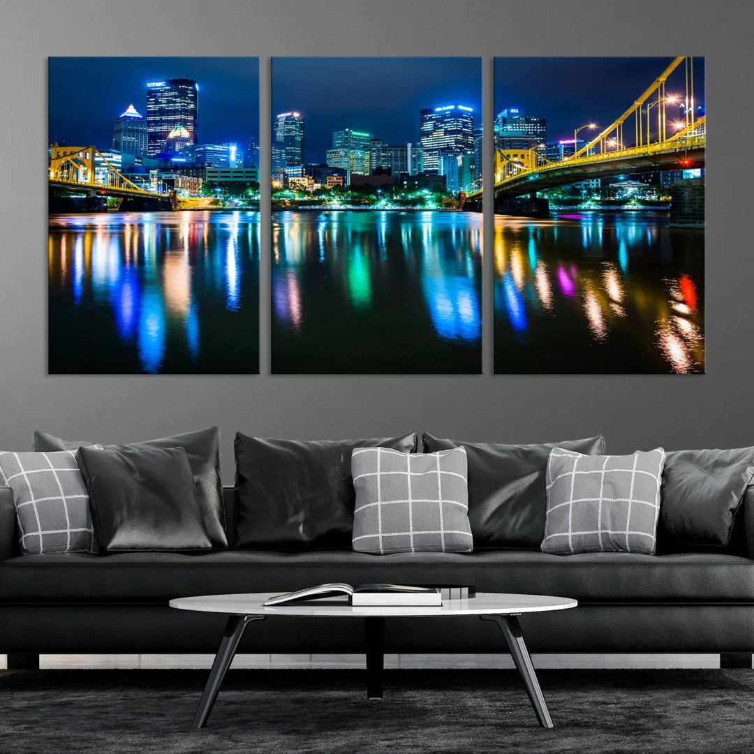 The "Downtown Pittsburgh at Night Canvas Wall Art" is a stunning museum-quality print that showcases the Pittsburgh skyline, reflecting over water and adorned with bright city lights.