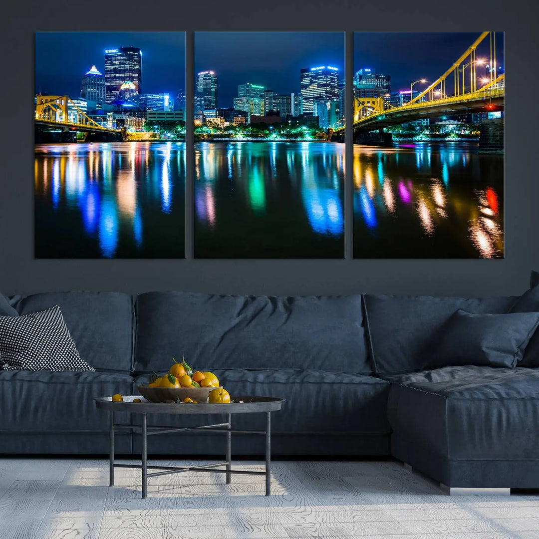 The "Downtown Pittsburgh at Night Canvas Wall Art" is a stunning museum-quality print that showcases the Pittsburgh skyline, reflecting over water and adorned with bright city lights.