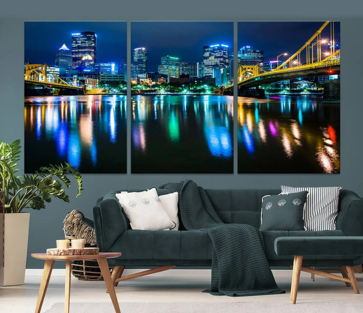 The "Downtown Pittsburgh at Night Canvas Wall Art" is a stunning museum-quality print that showcases the Pittsburgh skyline, reflecting over water and adorned with bright city lights.