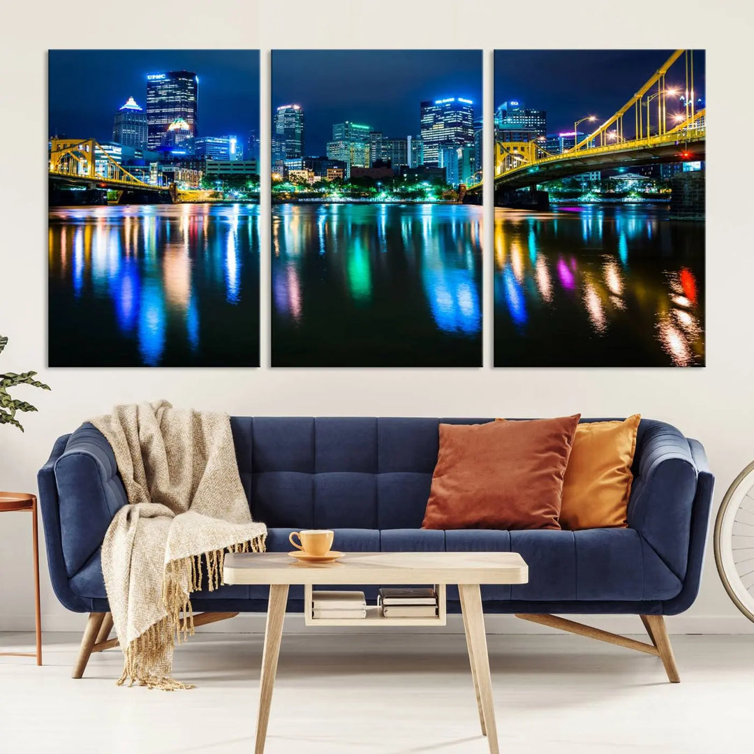 The "Downtown Pittsburgh at Night Canvas Wall Art" is a stunning museum-quality print that showcases the Pittsburgh skyline, reflecting over water and adorned with bright city lights.