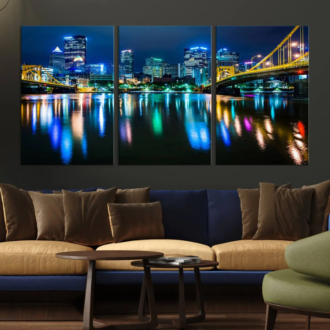 The "Downtown Pittsburgh at Night Canvas Wall Art" is a stunning museum-quality print that showcases the Pittsburgh skyline, reflecting over water and adorned with bright city lights.