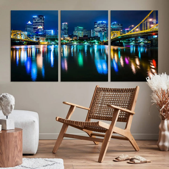 The "Downtown Pittsburgh at Night Canvas Wall Art" is a stunning museum-quality print that showcases the Pittsburgh skyline, reflecting over water and adorned with bright city lights.