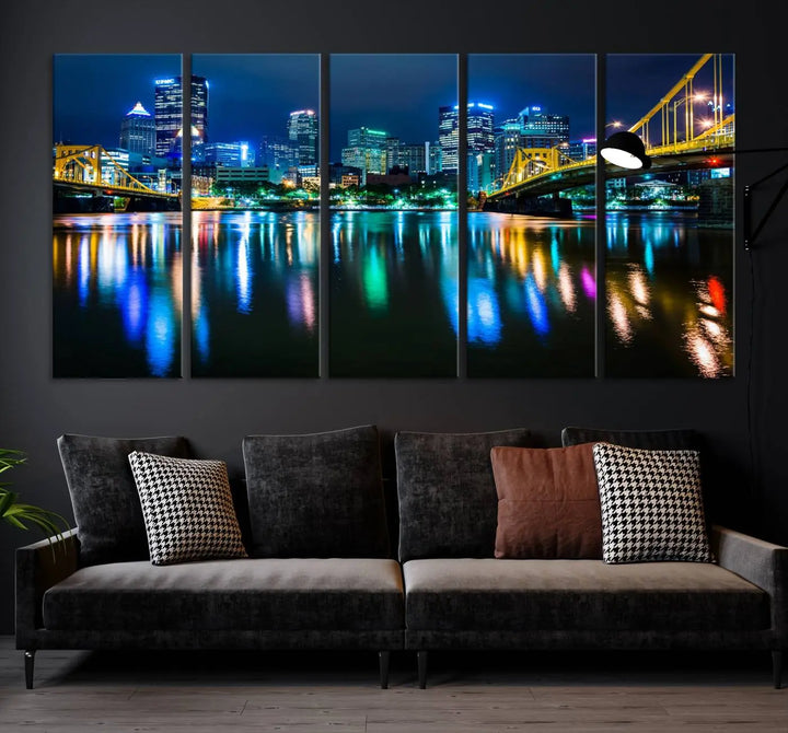 The "Downtown Pittsburgh at Night Canvas Wall Art" is a stunning museum-quality print that showcases the Pittsburgh skyline, reflecting over water and adorned with bright city lights.