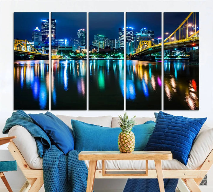 The "Downtown Pittsburgh at Night Canvas Wall Art" is a stunning museum-quality print that showcases the Pittsburgh skyline, reflecting over water and adorned with bright city lights.