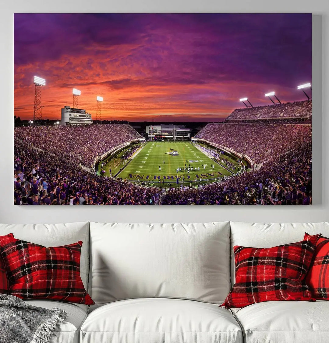 The East Carolina University Pirates Football Team Print, showcasing the vibrant Greenville Dowdy-Ficklen Stadium at sunset on museum-quality canvas and handcrafted in the USA, is a stunning piece of wall art.