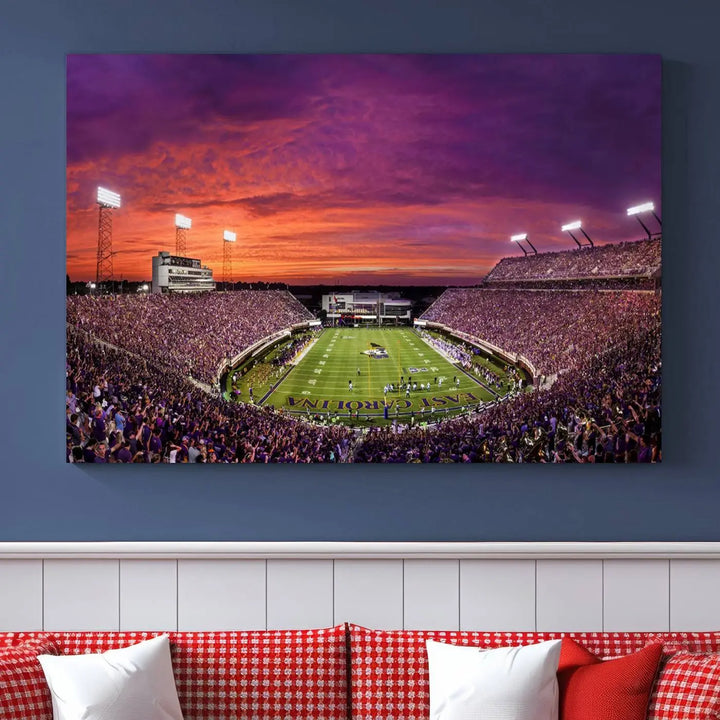 The East Carolina University Pirates Football Team Print, showcasing the vibrant Greenville Dowdy-Ficklen Stadium at sunset on museum-quality canvas and handcrafted in the USA, is a stunning piece of wall art.