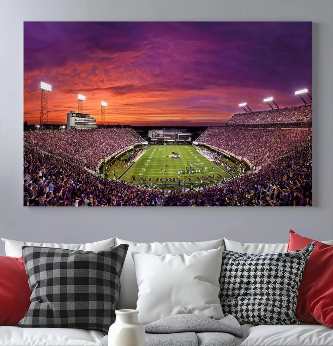 The East Carolina University Pirates Football Team Print, showcasing the vibrant Greenville Dowdy-Ficklen Stadium at sunset on museum-quality canvas and handcrafted in the USA, is a stunning piece of wall art.