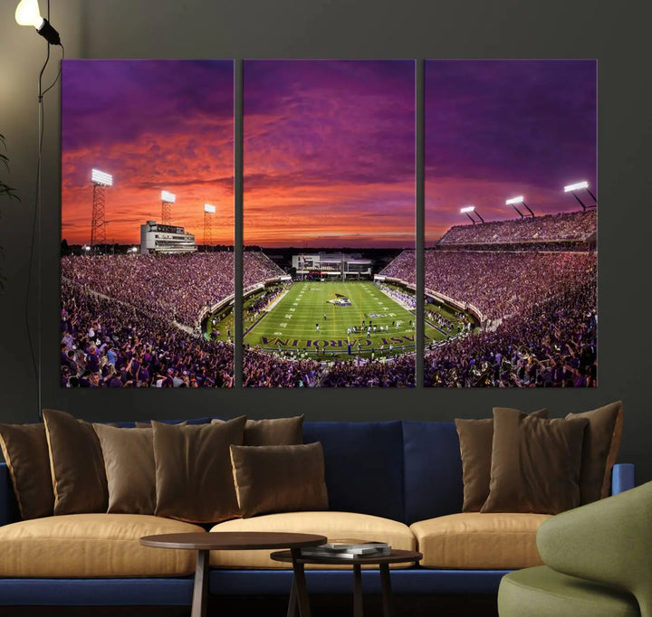 The East Carolina University Pirates Football Team Print, showcasing the vibrant Greenville Dowdy-Ficklen Stadium at sunset on museum-quality canvas and handcrafted in the USA, is a stunning piece of wall art.