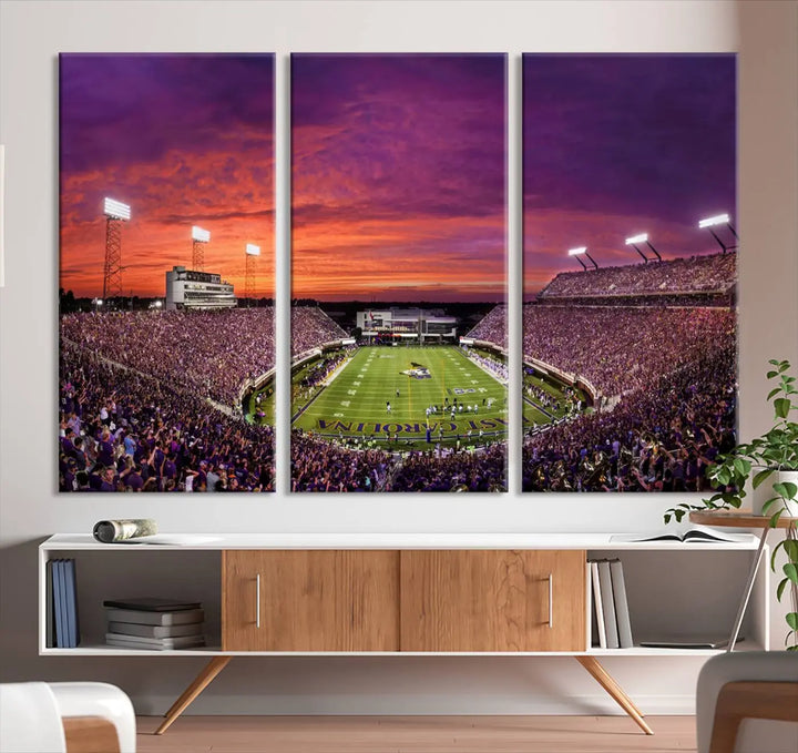 The East Carolina University Pirates Football Team Print, showcasing the vibrant Greenville Dowdy-Ficklen Stadium at sunset on museum-quality canvas and handcrafted in the USA, is a stunning piece of wall art.