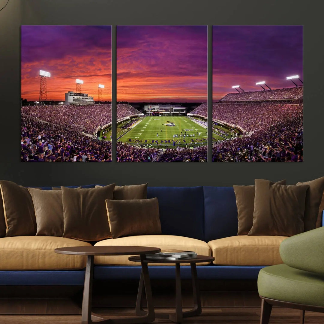 The East Carolina University Pirates Football Team Print, showcasing the vibrant Greenville Dowdy-Ficklen Stadium at sunset on museum-quality canvas and handcrafted in the USA, is a stunning piece of wall art.