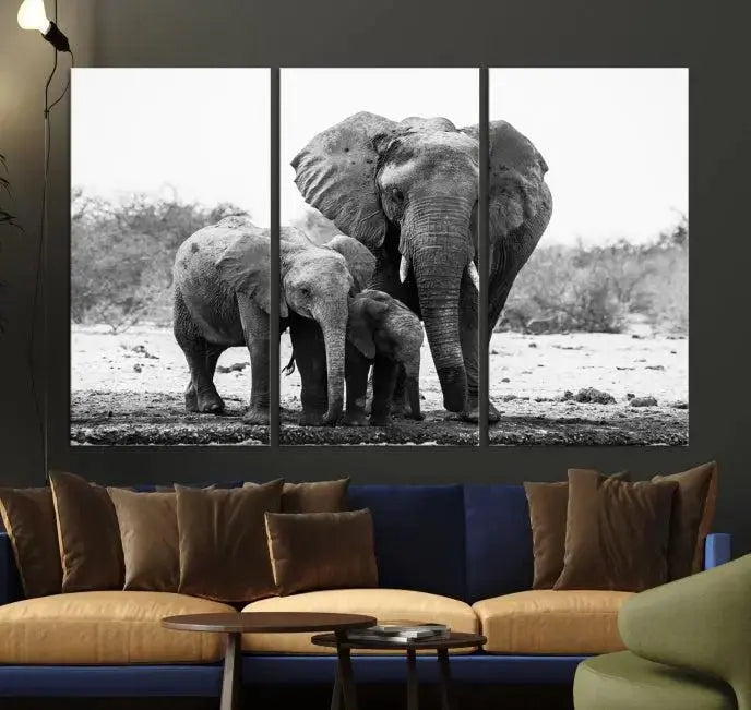 The Elephant Family Africa Wall Art Canvas Print, a black and white triptych of elephants, is presented as museum-quality canvas art.