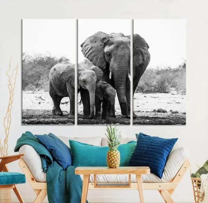 The Elephant Family Africa Wall Art Canvas Print, a black and white triptych of elephants, is presented as museum-quality canvas art.