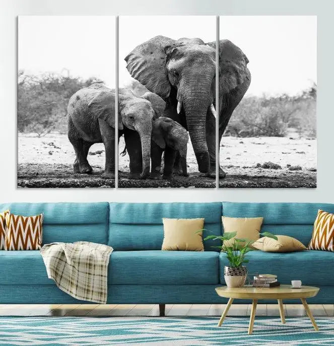 The Elephant Family Africa Wall Art Canvas Print, a black and white triptych of elephants, is presented as museum-quality canvas art.