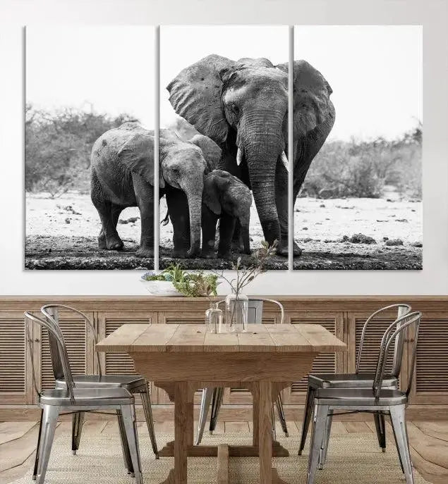 The Elephant Family Africa Wall Art Canvas Print, a black and white triptych of elephants, is presented as museum-quality canvas art.