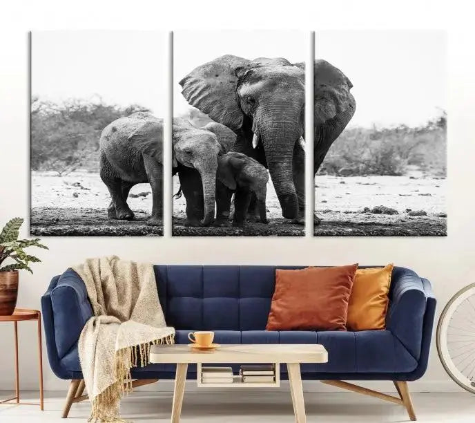 The Elephant Family Africa Wall Art Canvas Print, a black and white triptych of elephants, is presented as museum-quality canvas art.