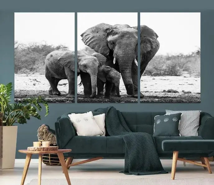 The Elephant Family Africa Wall Art Canvas Print, a black and white triptych of elephants, is presented as museum-quality canvas art.