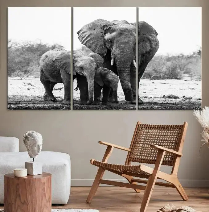 The Elephant Family Africa Wall Art Canvas Print, a black and white triptych of elephants, is presented as museum-quality canvas art.