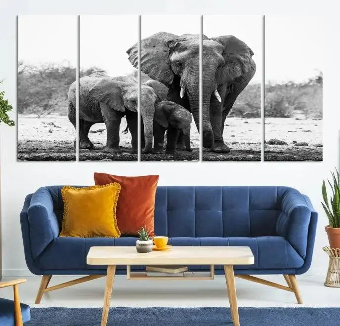 The Elephant Family Africa Wall Art Canvas Print, a black and white triptych of elephants, is presented as museum-quality canvas art.