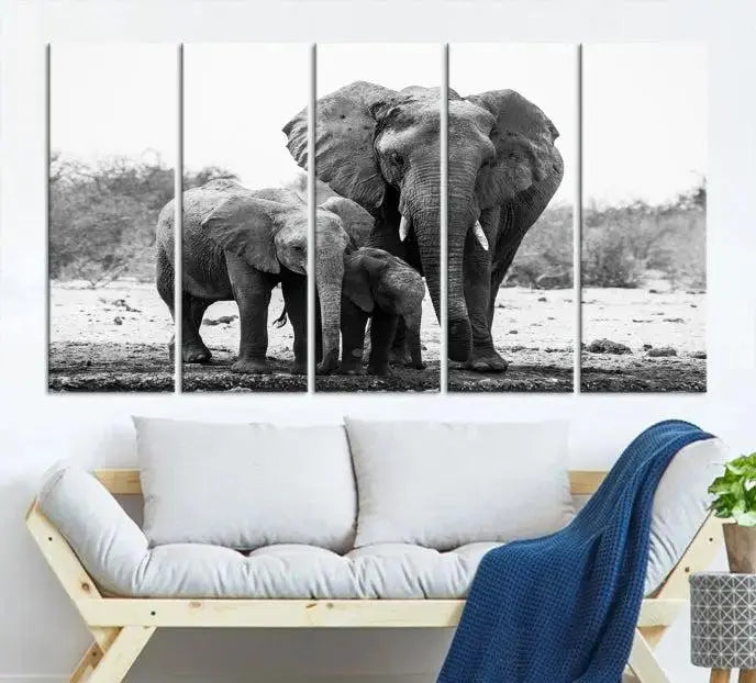 The Elephant Family Africa Wall Art Canvas Print, a black and white triptych of elephants, is presented as museum-quality canvas art.