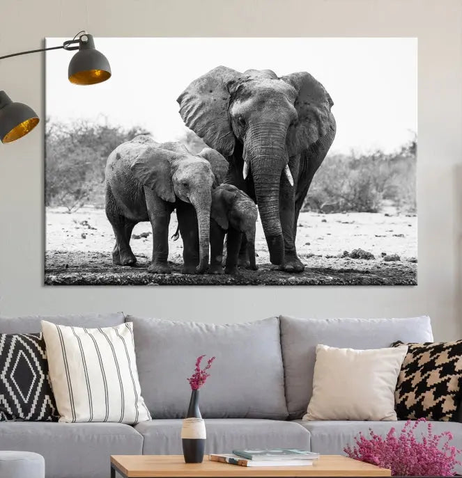 The Elephant Family Africa Wall Art Canvas Print, a black and white triptych of elephants, is presented as museum-quality canvas art.