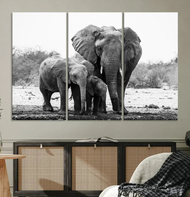 The Elephant Family Africa Wall Art Canvas Print, a black and white triptych of elephants, is presented as museum-quality canvas art.