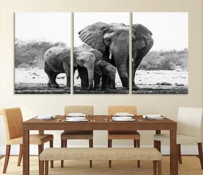 The Elephant Family Africa Wall Art Canvas Print, a black and white triptych of elephants, is presented as museum-quality canvas art.