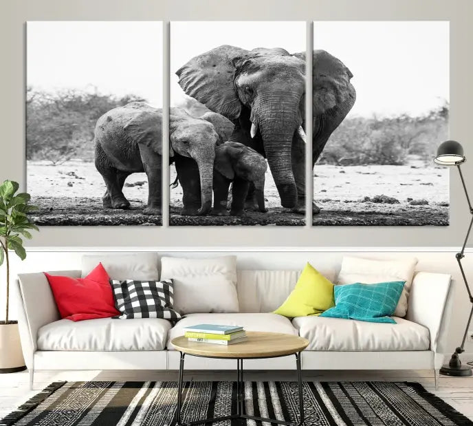 The Elephant Family Africa Wall Art Canvas Print, a black and white triptych of elephants, is presented as museum-quality canvas art.