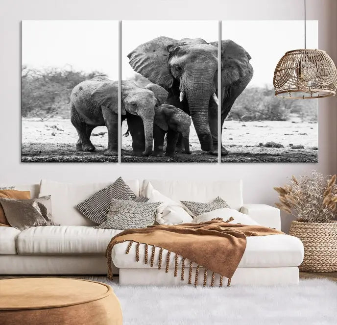 The Elephant Family Africa Wall Art Canvas Print, a black and white triptych of elephants, is presented as museum-quality canvas art.