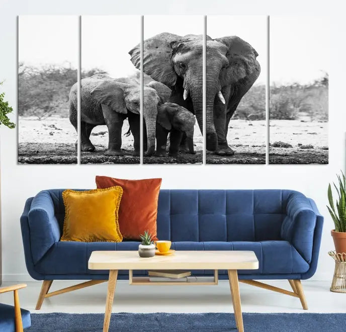 The Elephant Family Africa Wall Art Canvas Print, a black and white triptych of elephants, is presented as museum-quality canvas art.