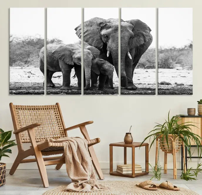 The Elephant Family Africa Wall Art Canvas Print, a black and white triptych of elephants, is presented as museum-quality canvas art.