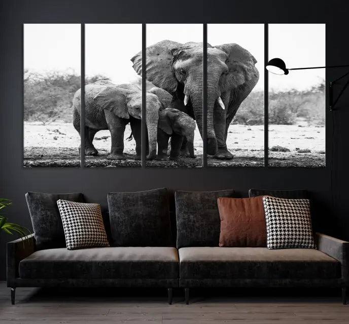 The Elephant Family Africa Wall Art Canvas Print, a black and white triptych of elephants, is presented as museum-quality canvas art.