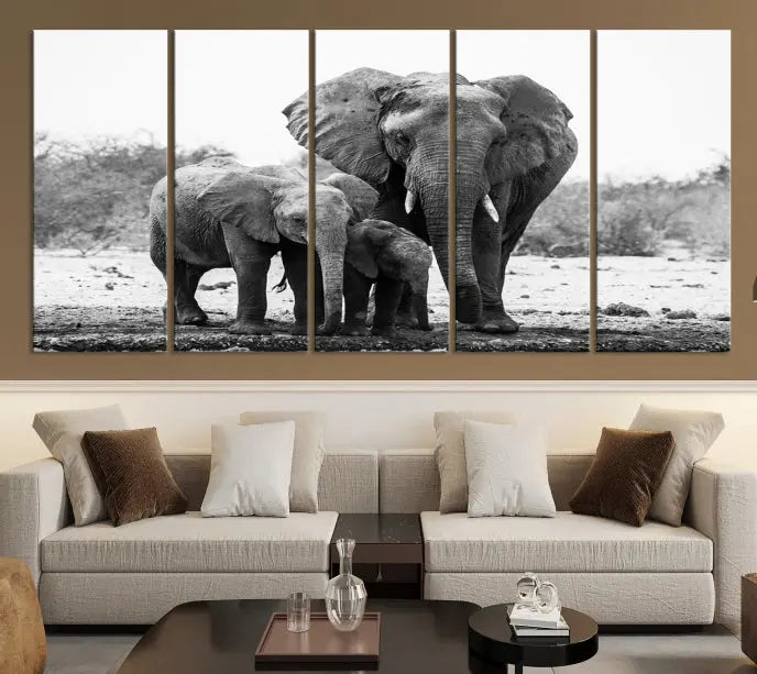 The Elephant Family Africa Wall Art Canvas Print, a black and white triptych of elephants, is presented as museum-quality canvas art.