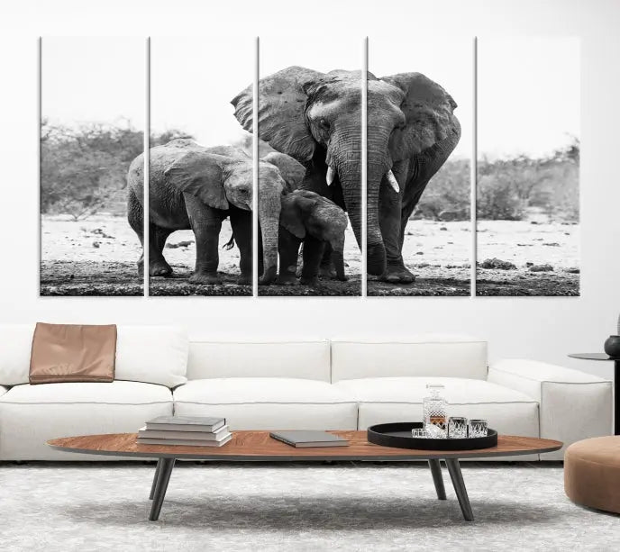 The Elephant Family Africa Wall Art Canvas Print, a black and white triptych of elephants, is presented as museum-quality canvas art.