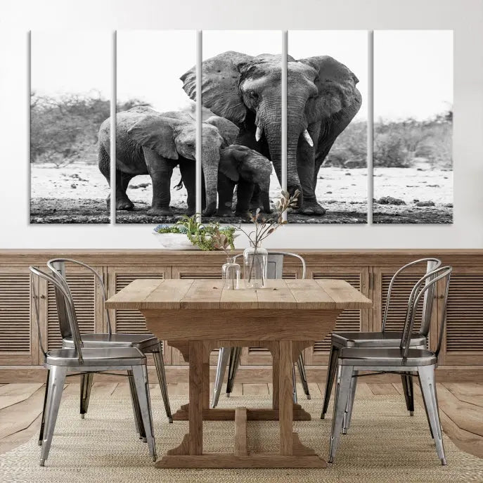 The Elephant Family Africa Wall Art Canvas Print, a black and white triptych of elephants, is presented as museum-quality canvas art.