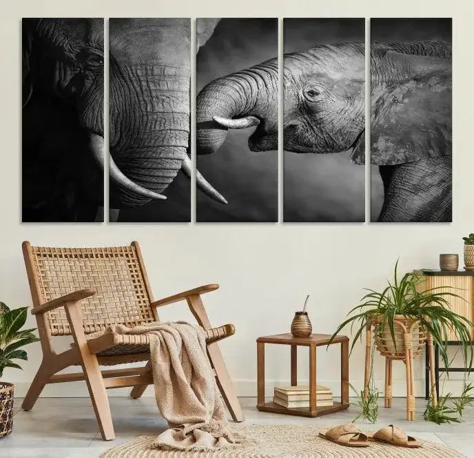 The "Elephant Family Wall Art Canvas Print" is a black-and-white triptych depicting elephants touching trunks, crafted on museum-quality canvas with a UV-protective coating. This ready-to-hang piece adds an elegant touch to any room.