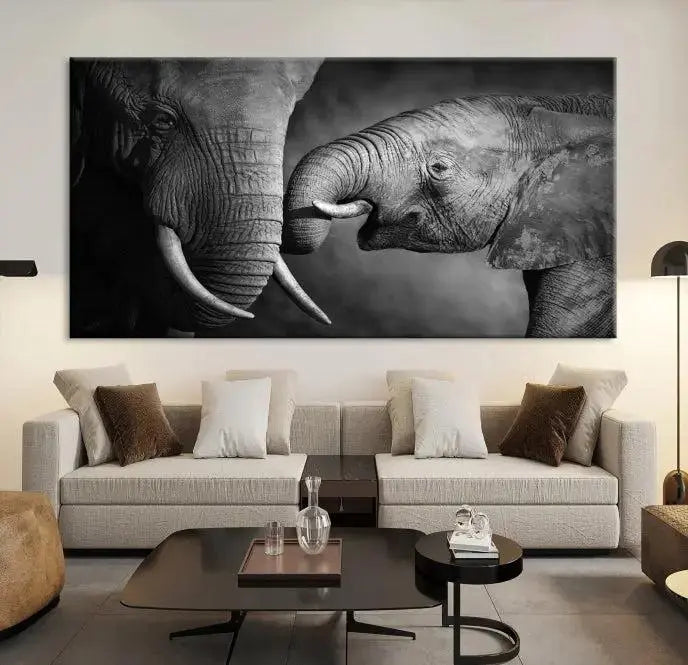 The "Elephant Family Wall Art Canvas Print" is a black-and-white triptych depicting elephants touching trunks, crafted on museum-quality canvas with a UV-protective coating. This ready-to-hang piece adds an elegant touch to any room.