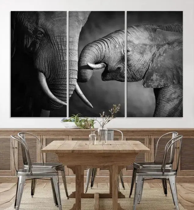 The "Elephant Family Wall Art Canvas Print" is a black-and-white triptych depicting elephants touching trunks, crafted on museum-quality canvas with a UV-protective coating. This ready-to-hang piece adds an elegant touch to any room.