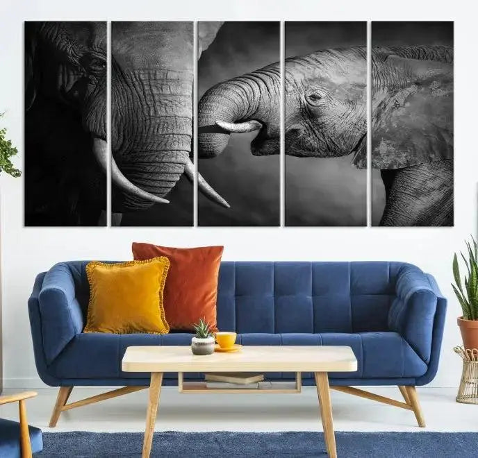 The "Elephant Family Wall Art Canvas Print" is a black-and-white triptych depicting elephants touching trunks, crafted on museum-quality canvas with a UV-protective coating. This ready-to-hang piece adds an elegant touch to any room.