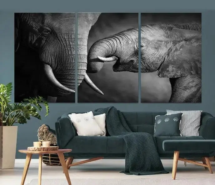 The "Elephant Family Wall Art Canvas Print" is a black-and-white triptych depicting elephants touching trunks, crafted on museum-quality canvas with a UV-protective coating. This ready-to-hang piece adds an elegant touch to any room.